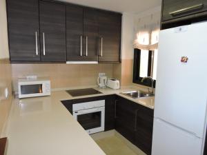 A kitchen or kitchenette at HL 010 3 bedroom apartment on HDA Golf Resort