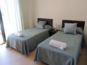 A bed or beds in a room at HL 010 3 bedroom apartment on HDA Golf Resort