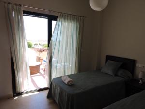 A bed or beds in a room at HL 010 3 bedroom apartment on HDA Golf Resort