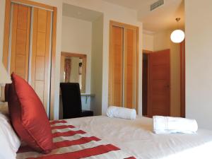 A bed or beds in a room at HL 010 3 bedroom apartment on HDA Golf Resort