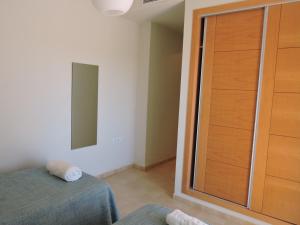A bed or beds in a room at HL 010 3 bedroom apartment on HDA Golf Resort