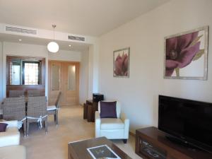 A television and/or entertainment centre at HL 010 3 bedroom apartment on HDA Golf Resort