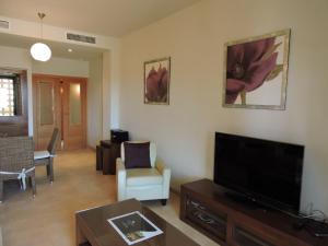 A television and/or entertainment centre at HL 010 3 bedroom apartment on HDA Golf Resort