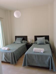 A bed or beds in a room at HL 010 3 bedroom apartment on HDA Golf Resort