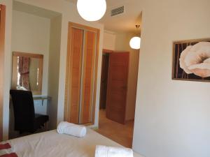 A bed or beds in a room at HL 010 3 bedroom apartment on HDA Golf Resort