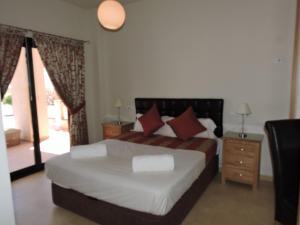 A bed or beds in a room at HL 010 3 bedroom apartment on HDA Golf Resort