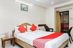 Postel nebo postele na pokoji v ubytování Hotel Rajdeep