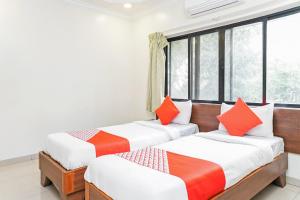 Postel nebo postele na pokoji v ubytování Hotel Rajdeep