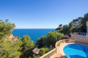 a view of the ocean from a house with a swimming pool at Casa Hayden in Jávea