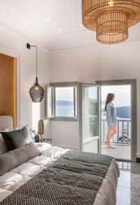 Ένα ή περισσότερα κρεβάτια σε δωμάτιο στο Amelot Art Suites