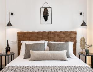 Ένα ή περισσότερα κρεβάτια σε δωμάτιο στο Amelot Art Suites
