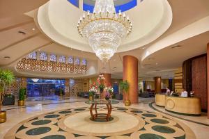 a large lobby with a large chandelier and a large lobby sidx sidx sidx at Parrotel Beach Resort in Sharm El Sheikh