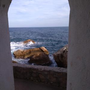 a view of the ocean through a window at Villa Azur Cap d'Ail in Cap d'Ail