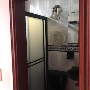 a glass door of a kitchen with items on it at Hotel SION in Pitalito