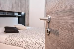 Postel nebo postele na pokoji v ubytování Hotel Gardesana
