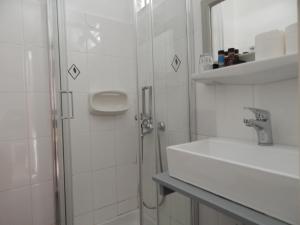 Koupelna v ubytování Posidonio Hotel