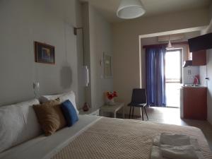 Postel nebo postele na pokoji v ubytování Posidonio Hotel