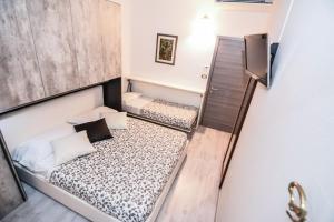Postel nebo postele na pokoji v ubytování Hotel Gardesana