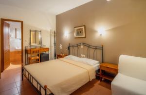 מיטה או מיטות בחדר ב-River Side Rooms