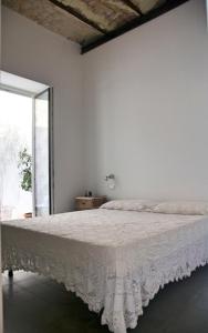 A bed or beds in a room at Casa Nonnona