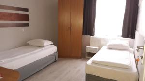 Ένα ή περισσότερα κρεβάτια σε δωμάτιο στο Rio Family Hotel