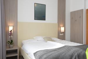 Postel nebo postele na pokoji v ubytování Hotel Venezia