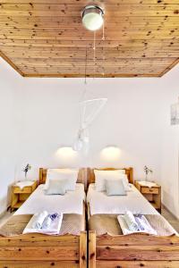 Ένα ή περισσότερα κρεβάτια σε δωμάτιο στο Villa Danai