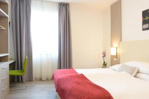 Postel nebo postele na pokoji v ubytování Hotel Venezia