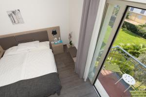 Postel nebo postele na pokoji v ubytování Hotel Venezia
