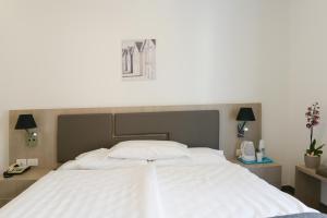 Postel nebo postele na pokoji v ubytování Hotel Venezia