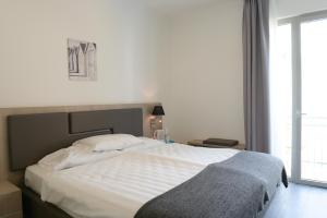 Postel nebo postele na pokoji v ubytování Hotel Venezia