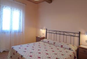 Postel nebo postele na pokoji v ubytování Agriturismo Le Ginestre