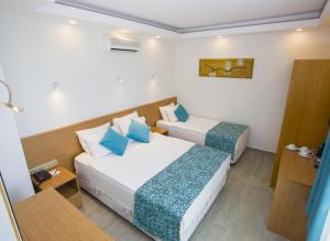 Ένα ή περισσότερα κρεβάτια σε δωμάτιο στο My Marin Otel