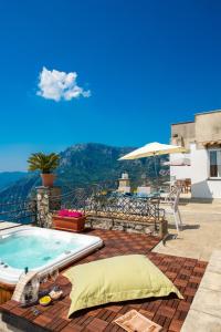a hot tub on the patio of a house at Maison Rosa in Positano