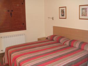 מיטה או מיטות בחדר ב-Los Picos de Tereñes