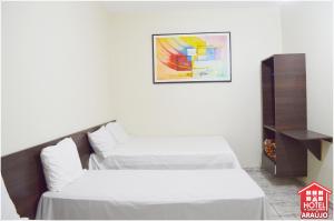 Säng eller sängar i ett rum på Hotel e Restaurante Araújo