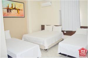 Łóżko lub łóżka w pokoju w obiekcie Hotel e Restaurante Araújo
