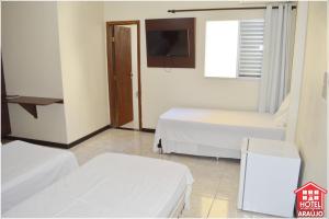 Łóżko lub łóżka w pokoju w obiekcie Hotel e Restaurante Araújo