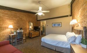 a hotel room with a bed and a couch at Mountain Chalet Snowmass in Snowmass Village