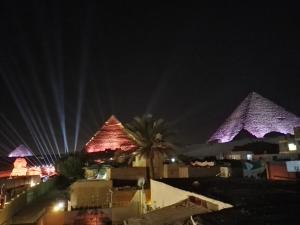 a view of the pyramids at night at Atlantis pyramids inn in Cairo