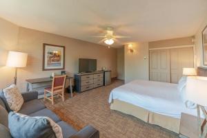 a hotel room with a bed and a desk at Mountain Chalet Snowmass in Snowmass Village