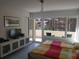 Postel nebo postele na pokoji v ubytování Ferienwohnung Zayetta Orange Cube Nr. 11a