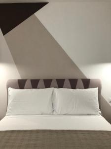 Posteľ alebo postele v izbe v ubytovaní SuitesGaribaldi