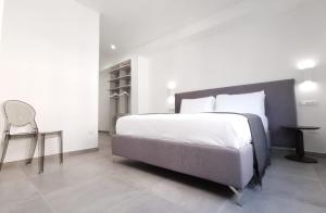 Posteľ alebo postele v izbe v ubytovaní SuitesGaribaldi