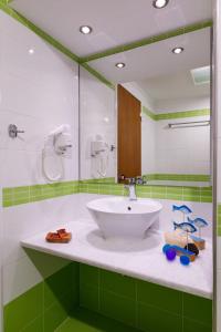 Koupelna v ubytování Sofia Hotel + 34 fotografií