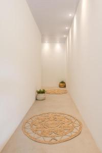 a hallway with two mats on the floor of a room at Noronha 350 in Fernando de Noronha