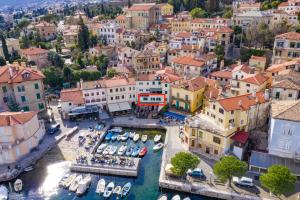 an aerial view of a town with boats in the water at Seaview Volosko Apartment in Opatija