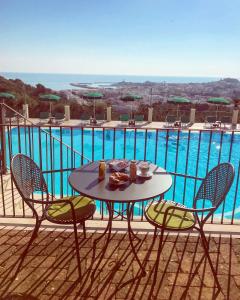 a patio table with a basket of food on top of it at Residence Chiesiola in Vieste