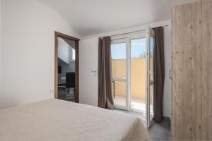 Posteľ alebo postele v izbe v ubytovaní Sky Apartments