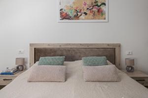Posteľ alebo postele v izbe v ubytovaní Sky Apartments